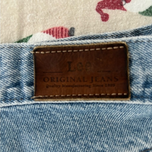 Dark blue ripped jean shorts. Hearts on the butt where the pockets should be. - Picture 2 of 3